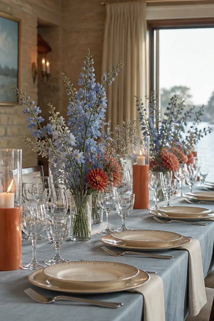 Ocean mist blue table decor with rust florals and cream candles