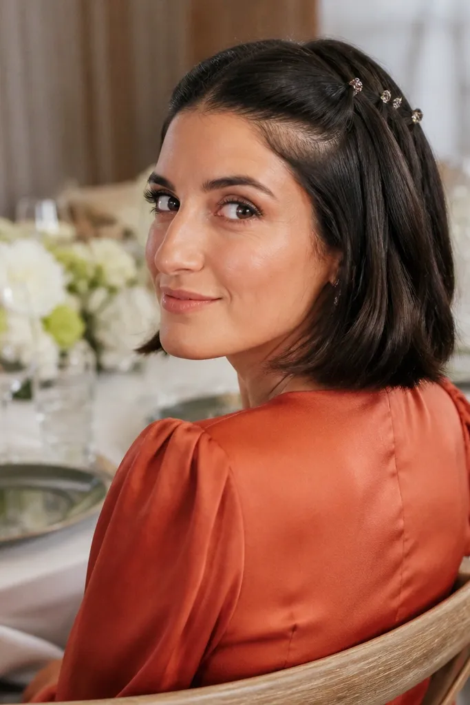 Short hair with a half-up style and small pinned sections like a waterfall