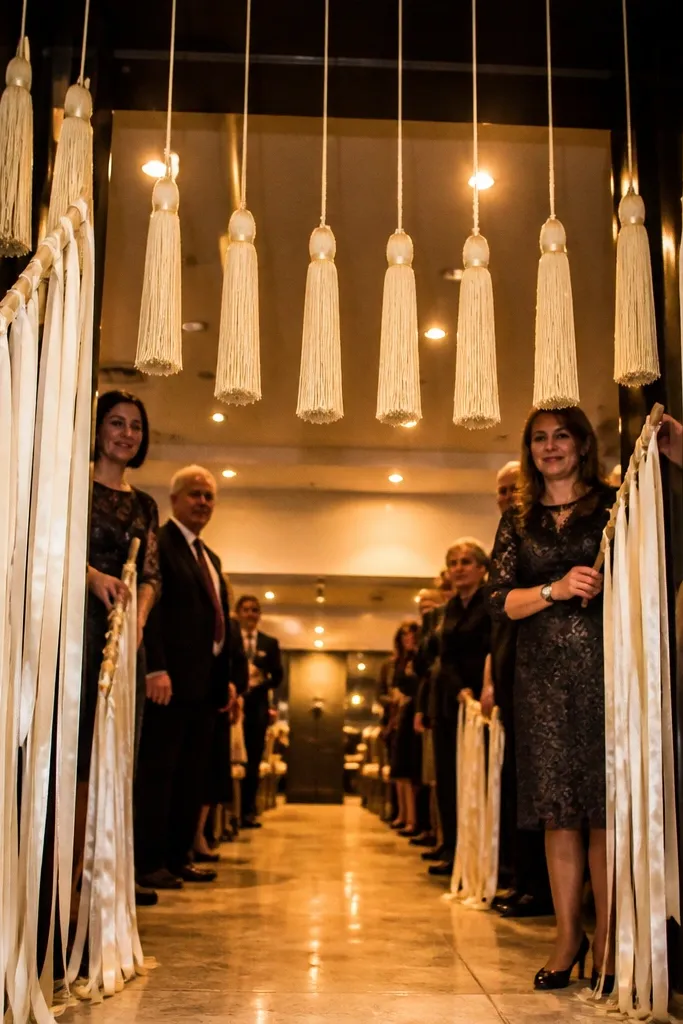 Ribbon and tassels hanging above an entrance walkway with soft movement